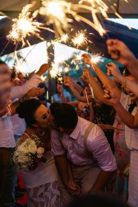Image of a Couple Running Through a Sparkling Tunnel