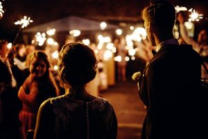 Image of a Couple Being Surprised By Sparklers During their Exit