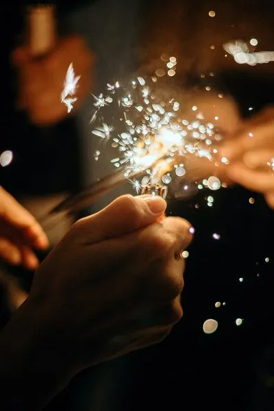 Image of a Person Lighting Sparklers at a Wedding